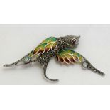 a silver plique a jour brooch in the form of a bird