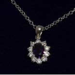 a silver amethyst and cz daisy style pendant necklace on silver chain