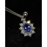 an 18ct white gold tanzanite and diamond pendant necklace of 90 points