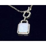 a silver and rectangular opal pendant necklace on silver chain