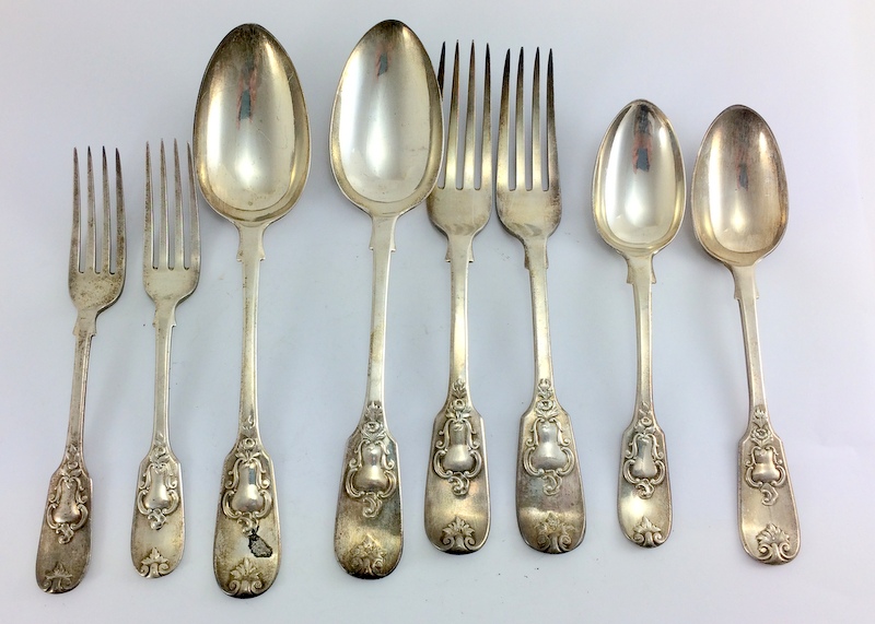 Silver serving spoons and forks together with other forks and matching spoons mix dates London