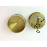 A brass cased clinometer 8cms diameter with impressed serial number 4058