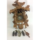 Wooden Cuckoo Clock depicting a hunting scene with deer and rifles