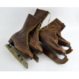 Two pairs of Vintage leather Ice Skates