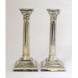 Pair of silver Corinthian candle sticks. 25cm tall