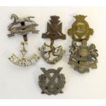 Six old cap badges including the 6th Volunteer Battalion Manchester Regiment - the 1st Volunteer