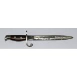 A Miniature bayonet engraved Ypres with an indistinct makers mark. Overall length 12.5cm