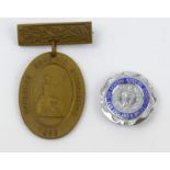 An enamel General Nursing Council badge engraved to S.R.N. O.M. Warren 1947 and an unnamed
