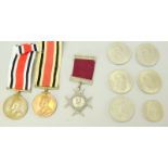 A small collection of medals and medallions including two Special Constabulary medals named to