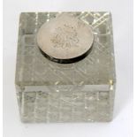 A silver and glass lidded inkwell