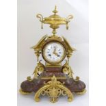 a 19thc French red marble mantle clock white dial blue numerals signed