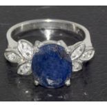 a silver cz and large sapphire set ring. Size M