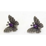 a pair of silver marcasite and amethyst earrings in the form of butterflys