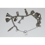 Silver charm bracelet and 12 charms