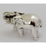 a cast silver figure of an elephant