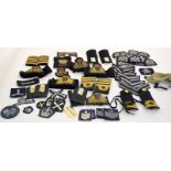 A box of assorted Royal Navy & Royal Air Force shoulder boards - cap badges - rank insignia -