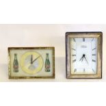 A Silver Framed Clock Together With A Vintage 7 Up Clock
