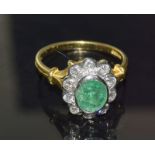 An 18Ct yellow gold Emerald And Diamond Ring In The Daisy Style