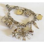 Ladies Silver charm bracelet and 10 charms