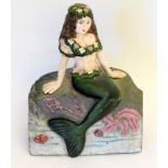 A Cast Figure Of A Mermaid In The Form Of A Doorstop