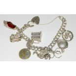 Ladies Silver charm bracelet and 8 charms