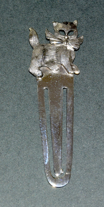 A Silver Bookmark With Cat Finial