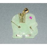 9ct gold set jade elephant pendant with inset ruby eye