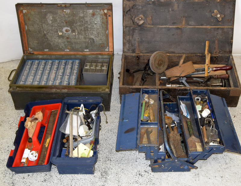 4 tool boxes with a selection of tools