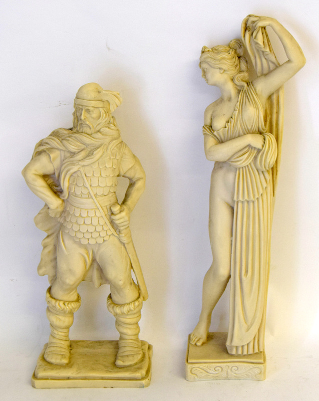 Two garden statues. 1 Viking 1 Greek lady