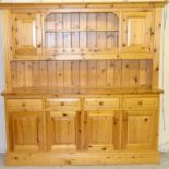 Two part pine dresser with four drawers and four cupboards. 190 x 190 x 40cm