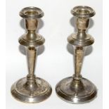 Pair of silver candlesticks 15.5cm tall. Hallmarked Chester 1918