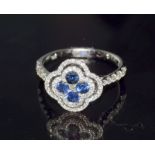 An 18Ct white gold Sapphire And Diamond Ring In The Form Of A Four Leaf Clover