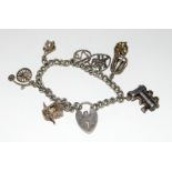 Ladies Silver charm bracelet and 7 charms