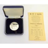 A cased 1983 Falkland Islands Prime Ministerial Visit silver coin. 38mm diameter. No. 022 of 500