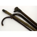 Bronze head walking stick, a Charlie Chaplin walking stick and two other sticks