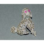 A Silver Marcasite Brooch In The Form Of A Poodle With Ruby Eyes