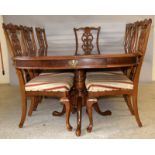 Mahogany extending dining table with 8 chairs to include carvers with shell motif. 75 x 245 (fully