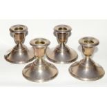 Four silver dwarf candlesticks hallmarked Birmingham 1955. 8.5cm tall