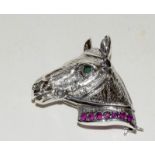 Silver horse brooch with ruby collar