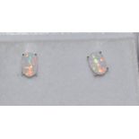 A pair of silver and opal ear studs