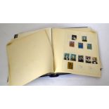 A blue album containing a substantial collection of GB stamps