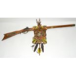 Reproduction percussion rifle and a cuckoo clock