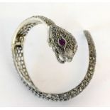 An Impressive Silver And Marcasite Snake Bangle With Enclosed Watch With Garnet Eyes