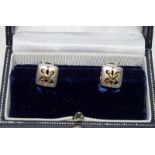 Pair of hallmarked 18ct gold and silver designer earrings
