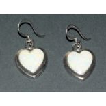 A Pair Of Silver Heart Shaped Opal Earrings