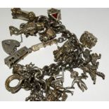 Ladies Silver charm bracelet and 20 charms