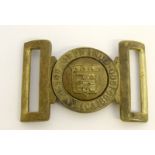 A rare early 20th century brass belt buckle to the Army Ordnance Corps with South Africa 1899-1900