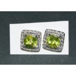 A Pair Of Silver Cz And Peridot Earrings