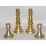 Two pairs of Victorian heavy brass candlesticks