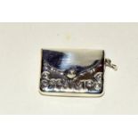 Silver postage stamp container in the form of a handbag